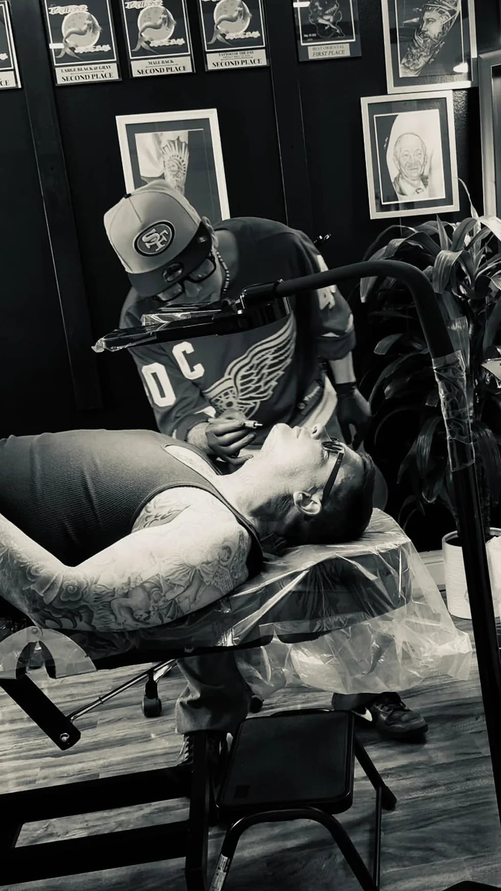 HoaDang tattooing a client in the studio